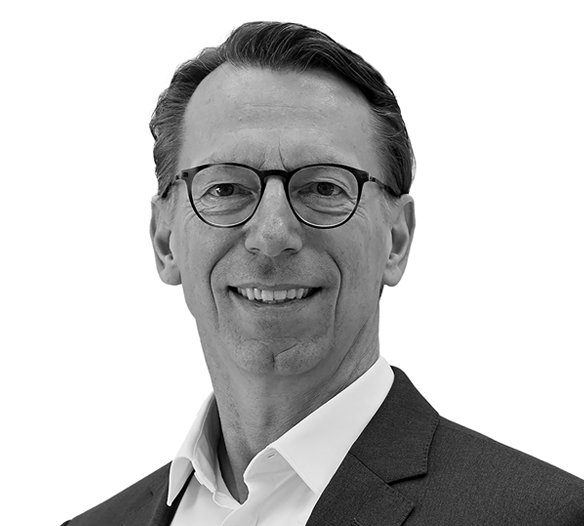 Black and white photo of Rainer Birkenbach, Chief Technology Officer at Brainlab