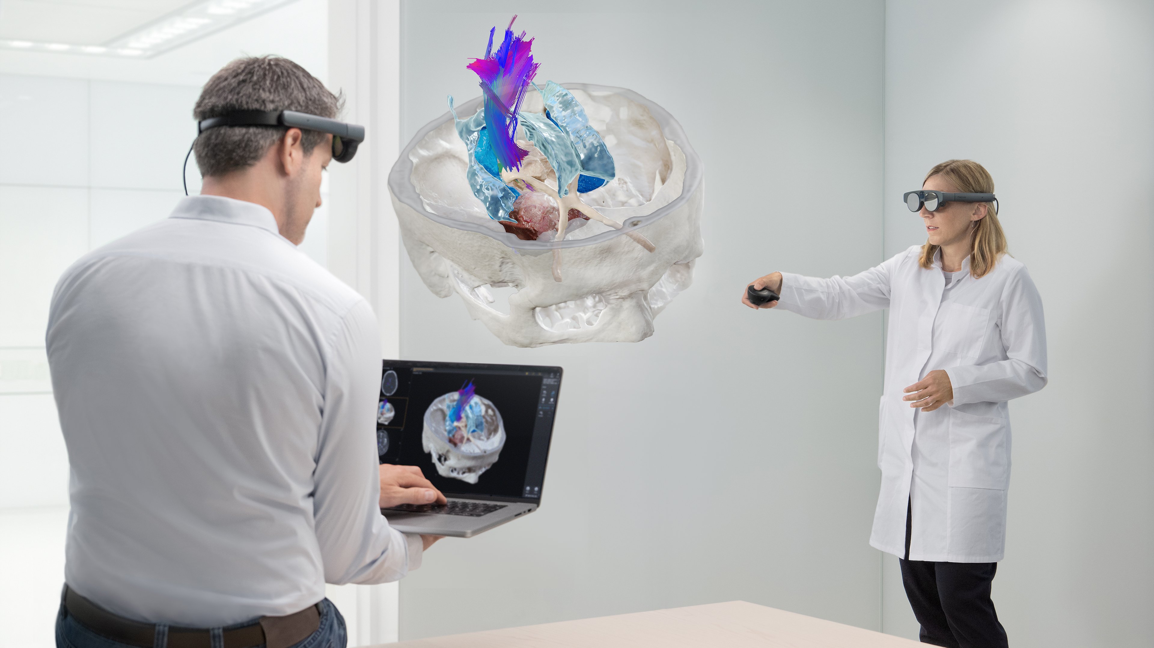 Brainlab's Mixed Reality Viewer in action, utilized by two individuals in an office setting