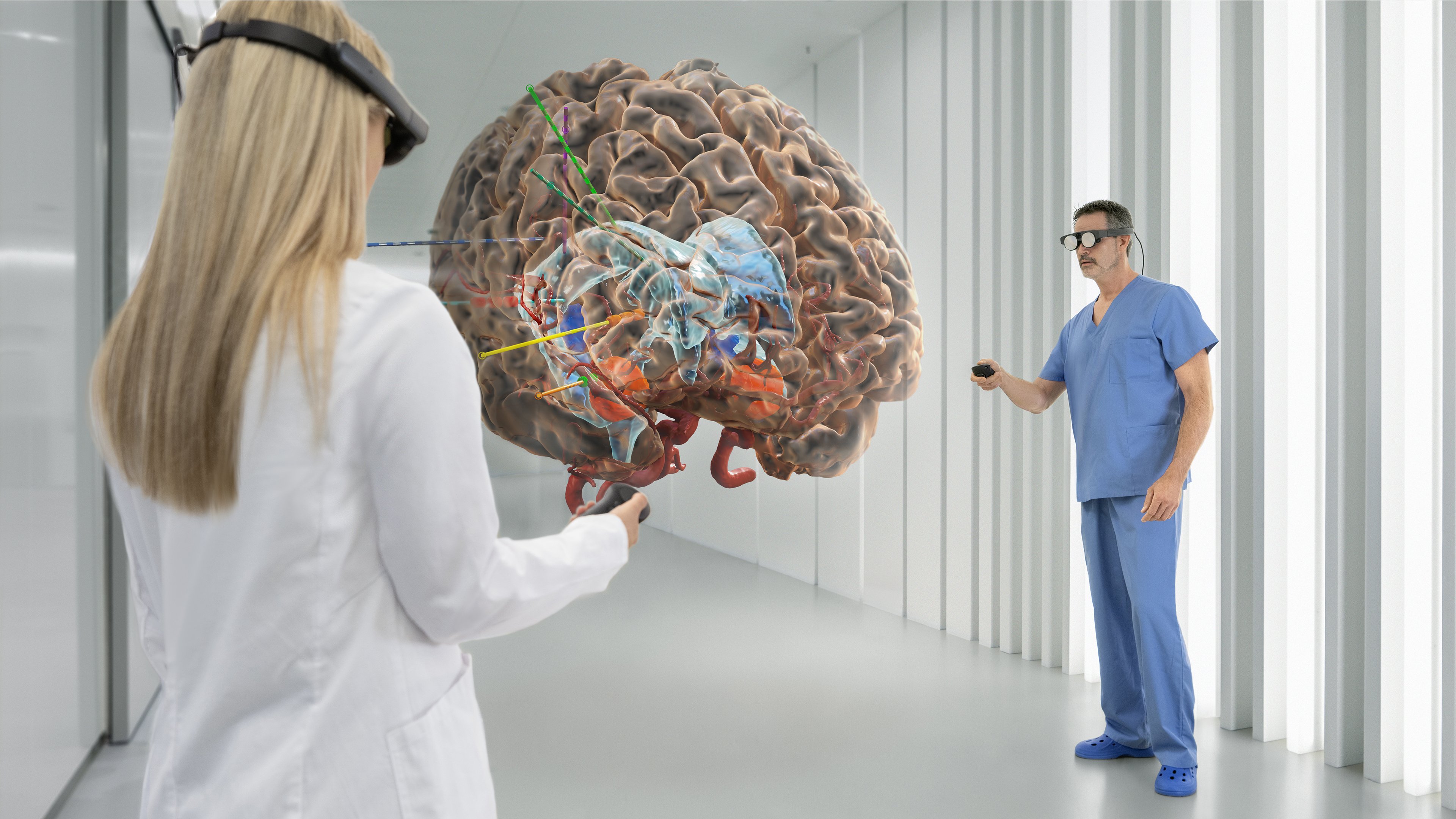 Brainlab's Mixed Reality Viewer in use at a hospital, with two individuals viewing a cranial image