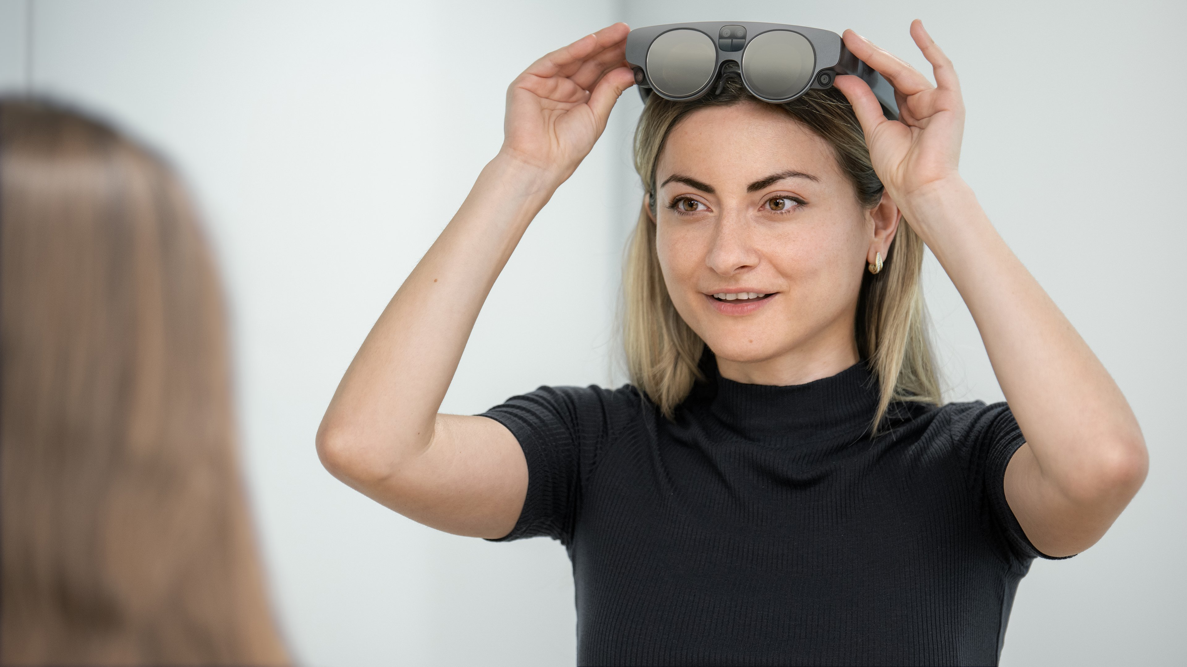 A person wearing the Mixed Reality Viewer glasses